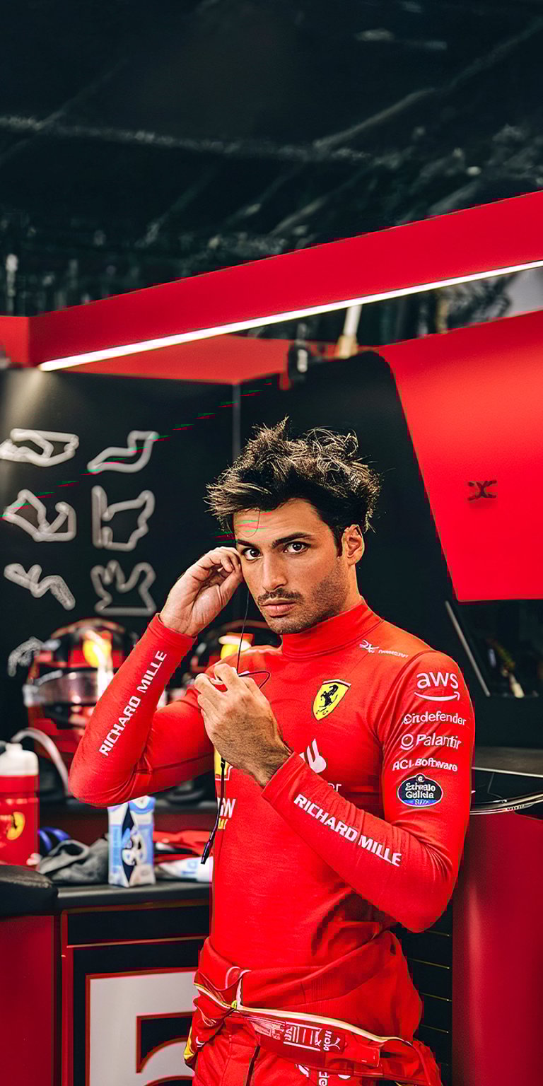 Carlos Sainz in Ferrari team wallpaper iPhone 4K