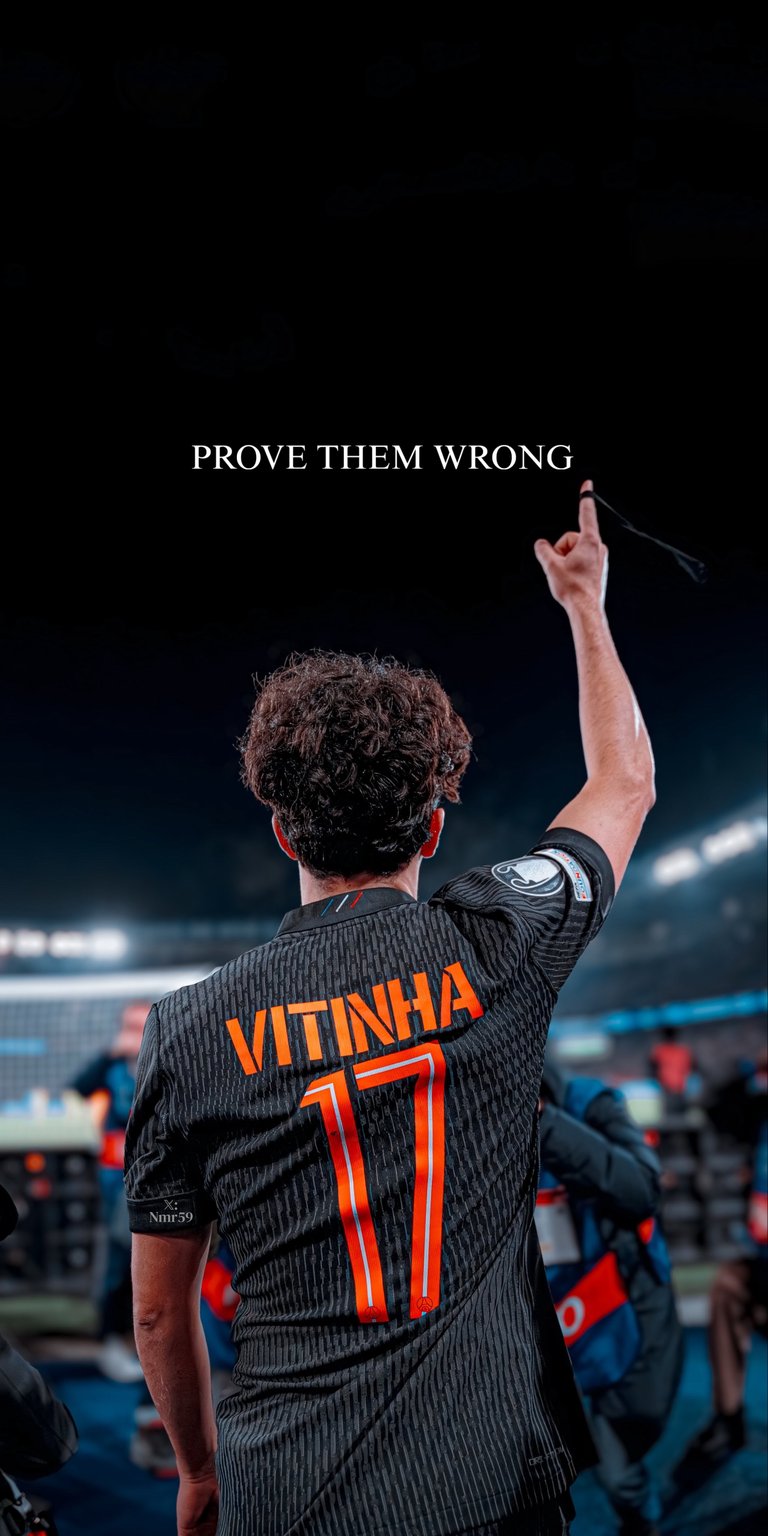 An inspiring 4K live wallpaper featuring Paris Saint-Germain midfielder Vitinha in his number 17 jersey, pointing to the sky with the motivational text "PROVE THEM WRONG" above him. This high-definition background is perfect for football fans looking for a dynamic and inspiring phone background.
