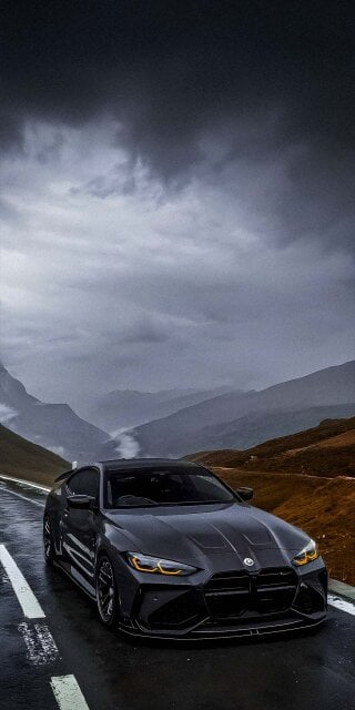 Matte Black BMW M4 in mountain ranges wallpaper iPhone