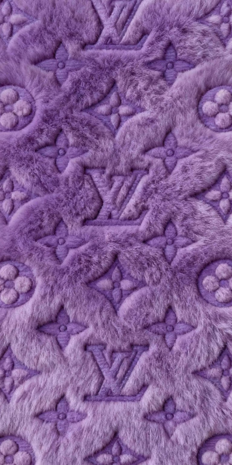 Download this plush Louis Vuitton 4K wallpaper for your iPhone, showcasing a soft lavender fur texture. The wallpaper features repeating LV logos and floral motifs, creating a stylish and luxurious look.