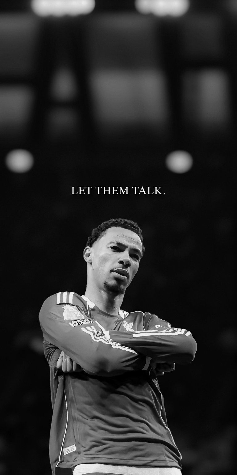 A striking black-and-white high-resolution mobile wallpaper featuring Hugo Ekitike. This creative edit reimagines the talented striker in the iconic Liverpool FC kit, centered under the minimalist motivational quote "LET THEM TALK." It’s a perfect aesthetic choice for fans of the player and those who enjoy "what-if" transfer concepts and clean, gritty sports edits.