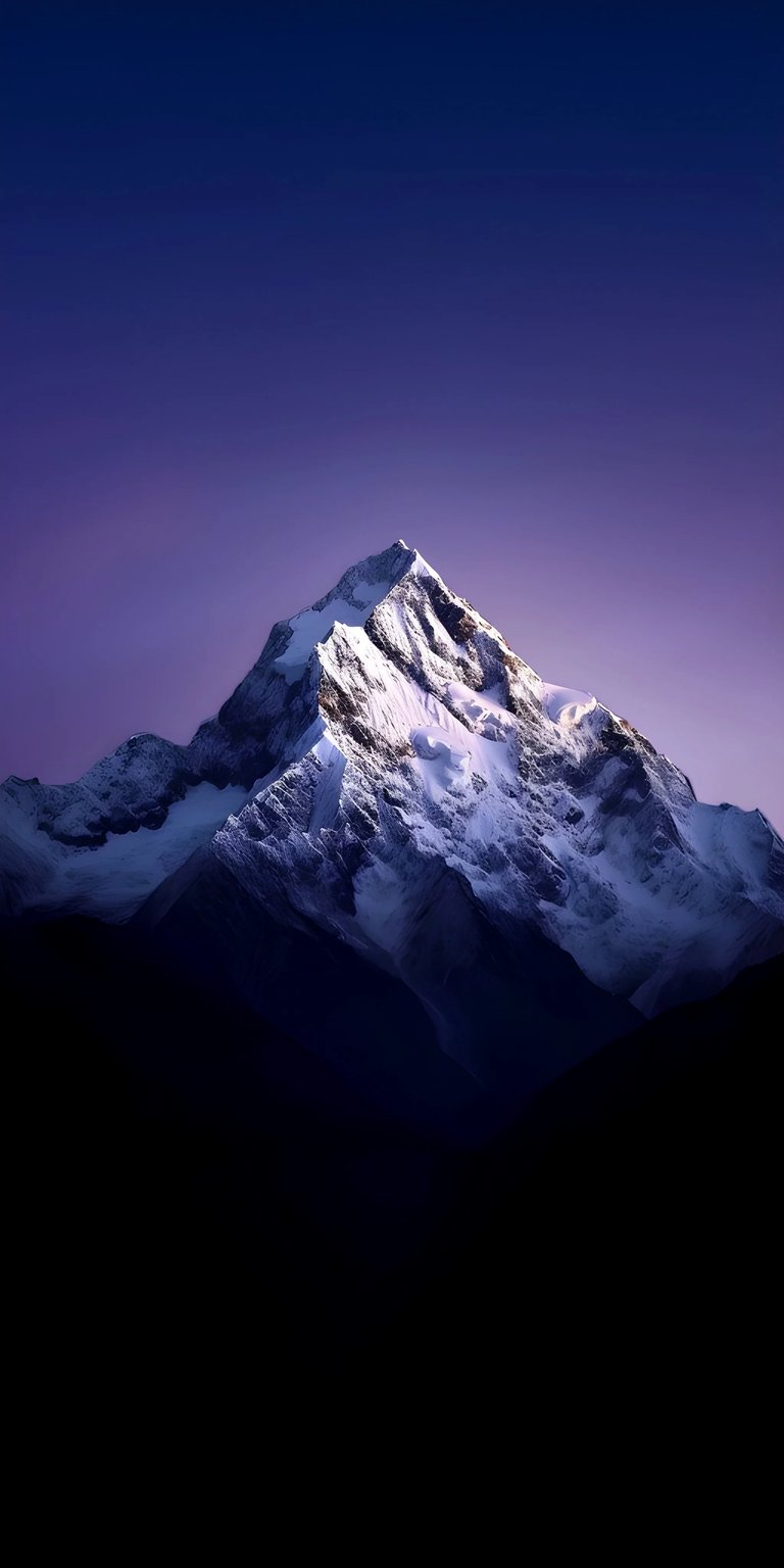 Download this breathtaking 4K mountain wallpaper for your iPhone, featuring a snow-capped peak against a dusky purple sky. The steep, rocky slopes are sharply contrasted against the dark valley below.