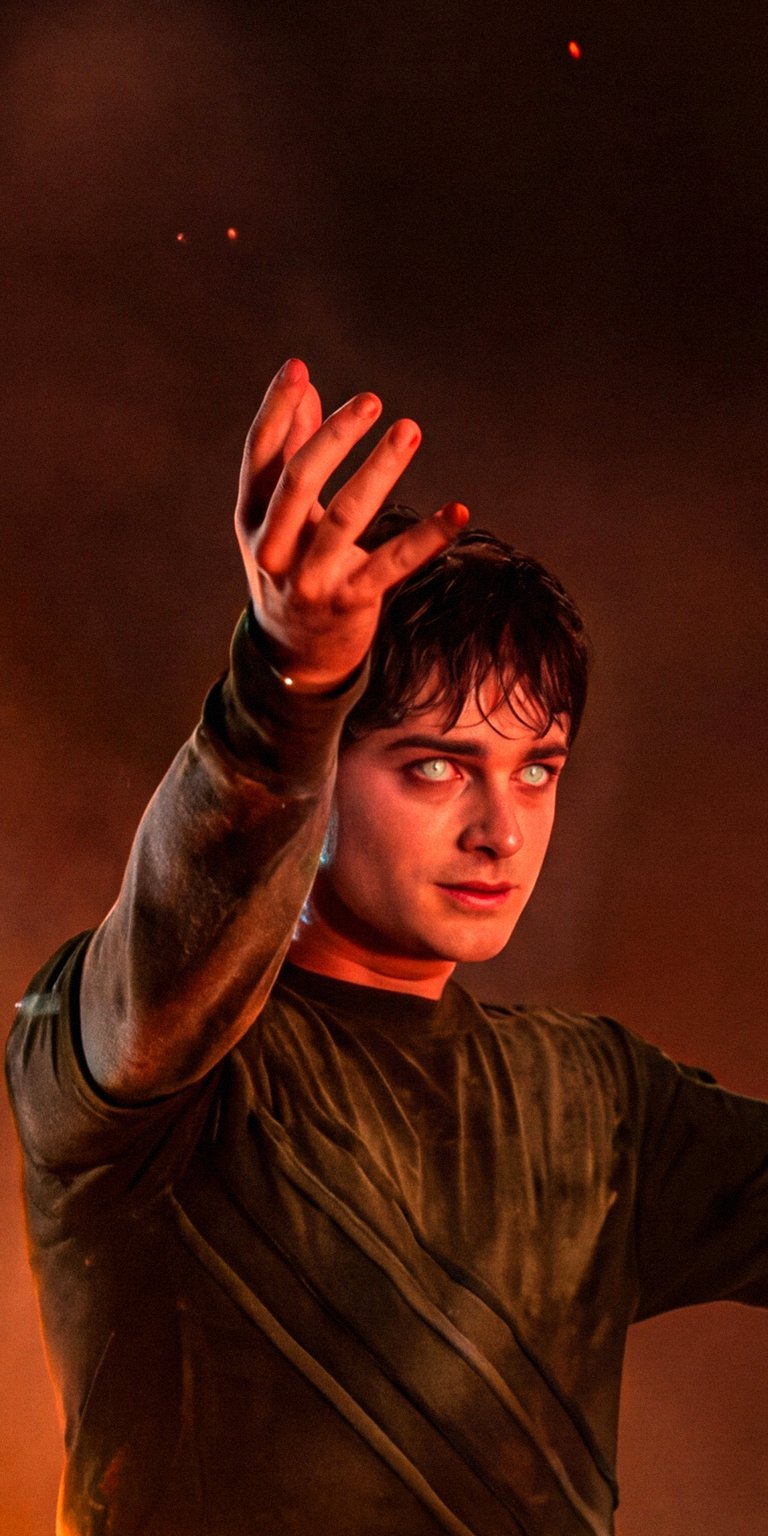 Get this Will Byers 4K wallpaper for your iPhone, featuring the actor with eerie white eyes against a fiery backdrop. This stunning wallpaper showcases Will Byers in a unique light, offering a captivating visual for your device.