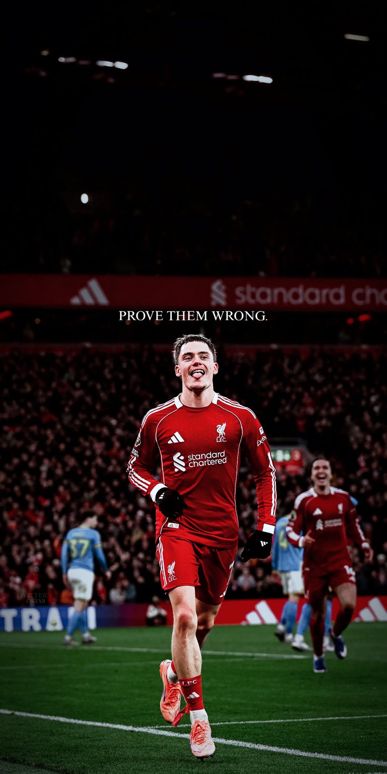 Celebrate Florian Wirtz’s high-profile era at Anfield. This wallpaper captures the German playmaker in the Liverpool home kit with the "Prove Them Wrong" typography, symbolizing his journey to conquer the Premier League under Arne Slot.