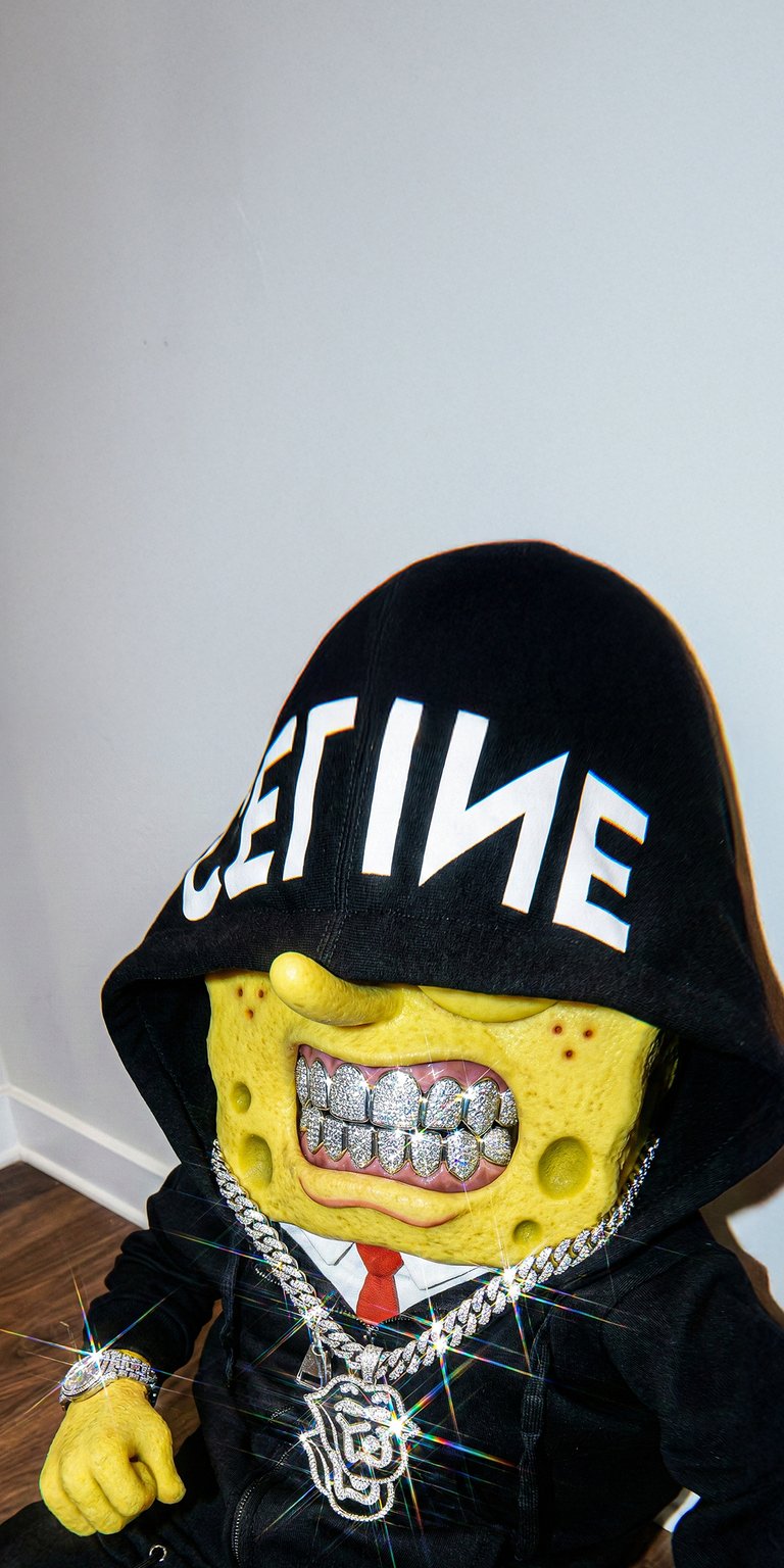 Upgrade your iPhone with this high-contrast 4K wallpaper featuring a hyper-realistic Spongebob in designer streetwear and diamond grillz. This striking aesthetic wallpaper uses sharp lighting and deep black tones to create a bold, modern look for your screen.