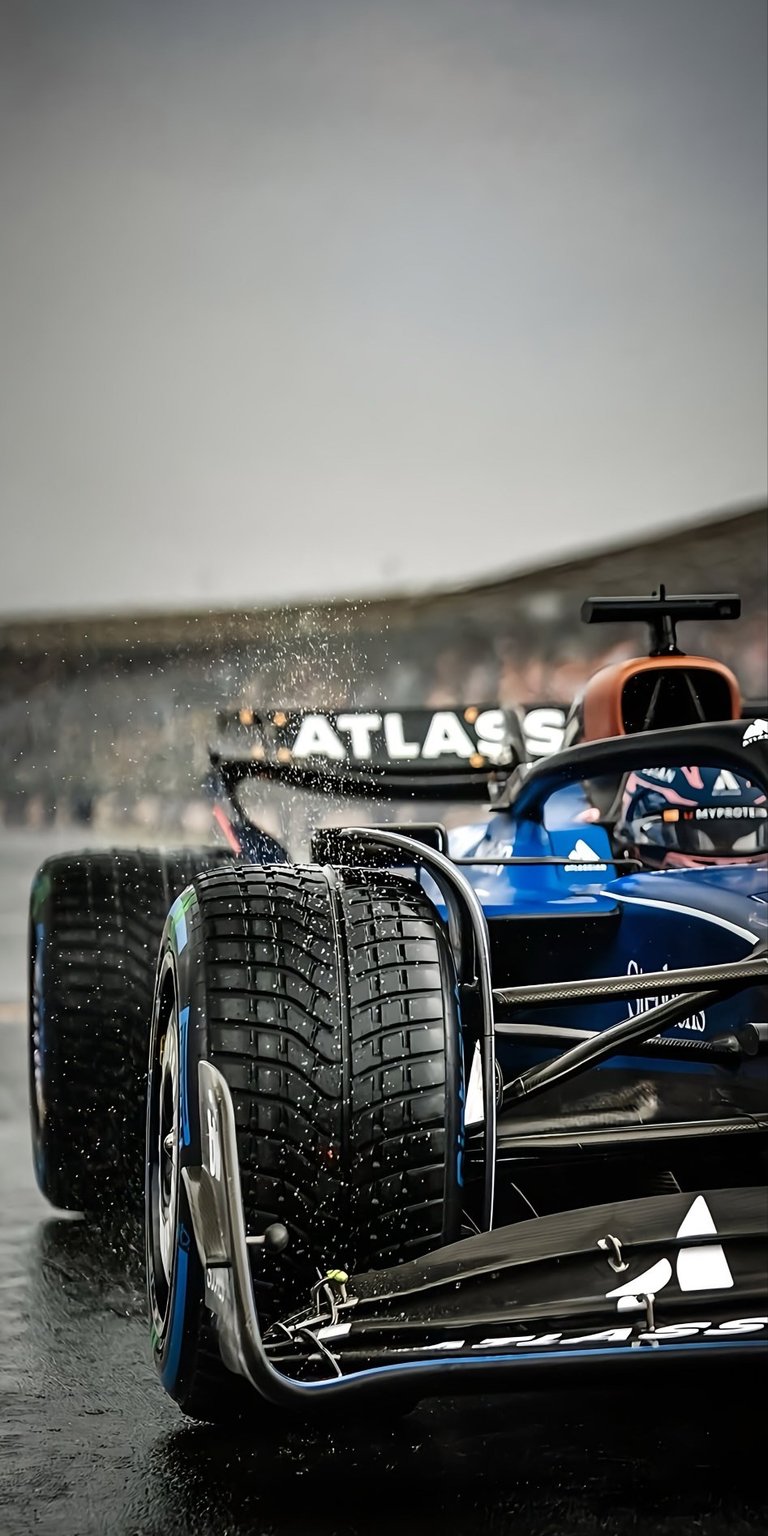 Formula 1 car 4K wallpaper in Aesthetic wallpapers style, capturing a high-speed racing moment with dramatic depth and motion. This wallpaper is optimized for iPhone, featuring dark asphalt tones, wet track reflections, and intense lighting that gives the wallpaper a powerful, adrenaline-filled mood.