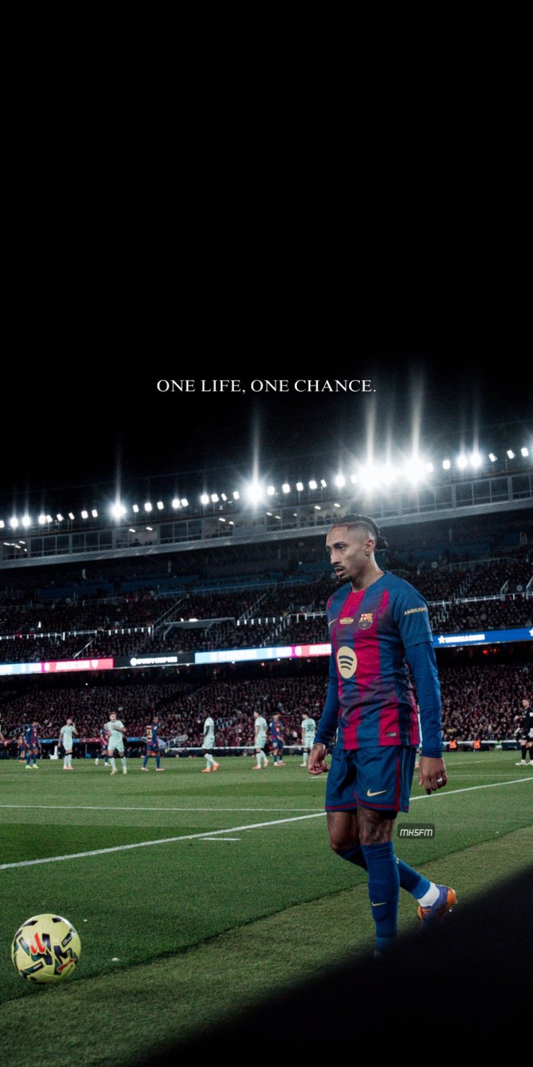 A powerful image of FC Barcelona's Brazilian forward, Raphinha, on the pitch at Spotify Camp Nou, accompanied by the inspirational text "ONE LIFE. ONE CHANCE.". Perfect for football fans, motivational themes, and users who admire Raphinha's fighting spirit and dedication to his dream of succeeding at Barça. Works beautifully on iPhone, Android, and AMOLED displays.