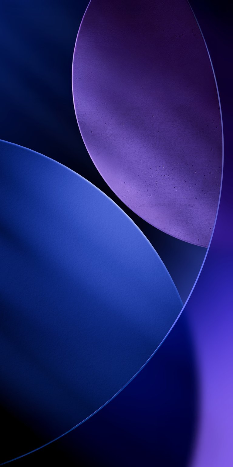 Elevate your iPhone screen with this stunning 4K wallpaper showcasing sleek curves and a captivating interplay of purple and blue tones. The abstract design offers a modern aesthetic with its geometric shapes and smooth texture, making this wallpaper a must-have.