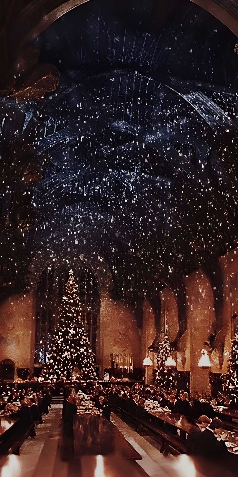 Adorn your iPhone with this magical Hogwarts Christmas 4K wallpaper. The grand hall is filled with twinkling lights, snow falling from the enchanted ceiling, and festive Christmas trees.