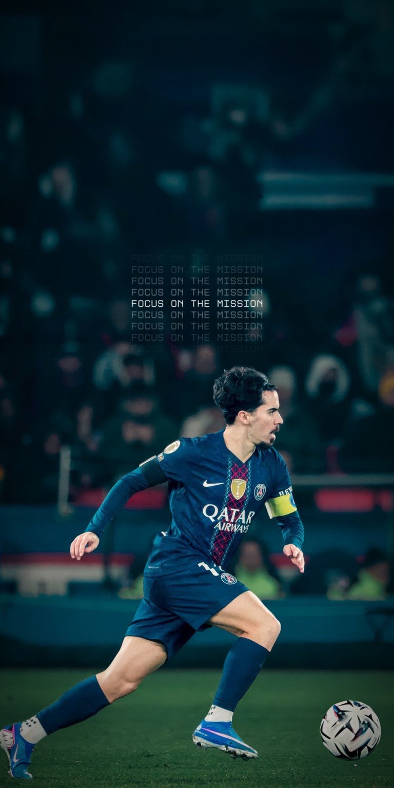 Elevate your iPhone screen with this sleek 4K wallpaper showcasing Vitinha in action for Paris Saint-Germain. This wallpaper highlights the midfield star in the classic dark blue PSG kit with a clean "Focus on the Mission" typography overlay.
