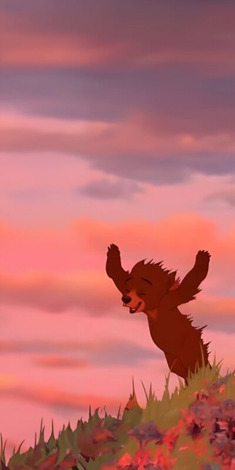 This 4K wallpaper features Kenai and Koda, and is ideal for iPhones as matching wallpapers. Featuring a beautiful sky with pink clouds and red flowers, this is a great wallpaper for 2 people.