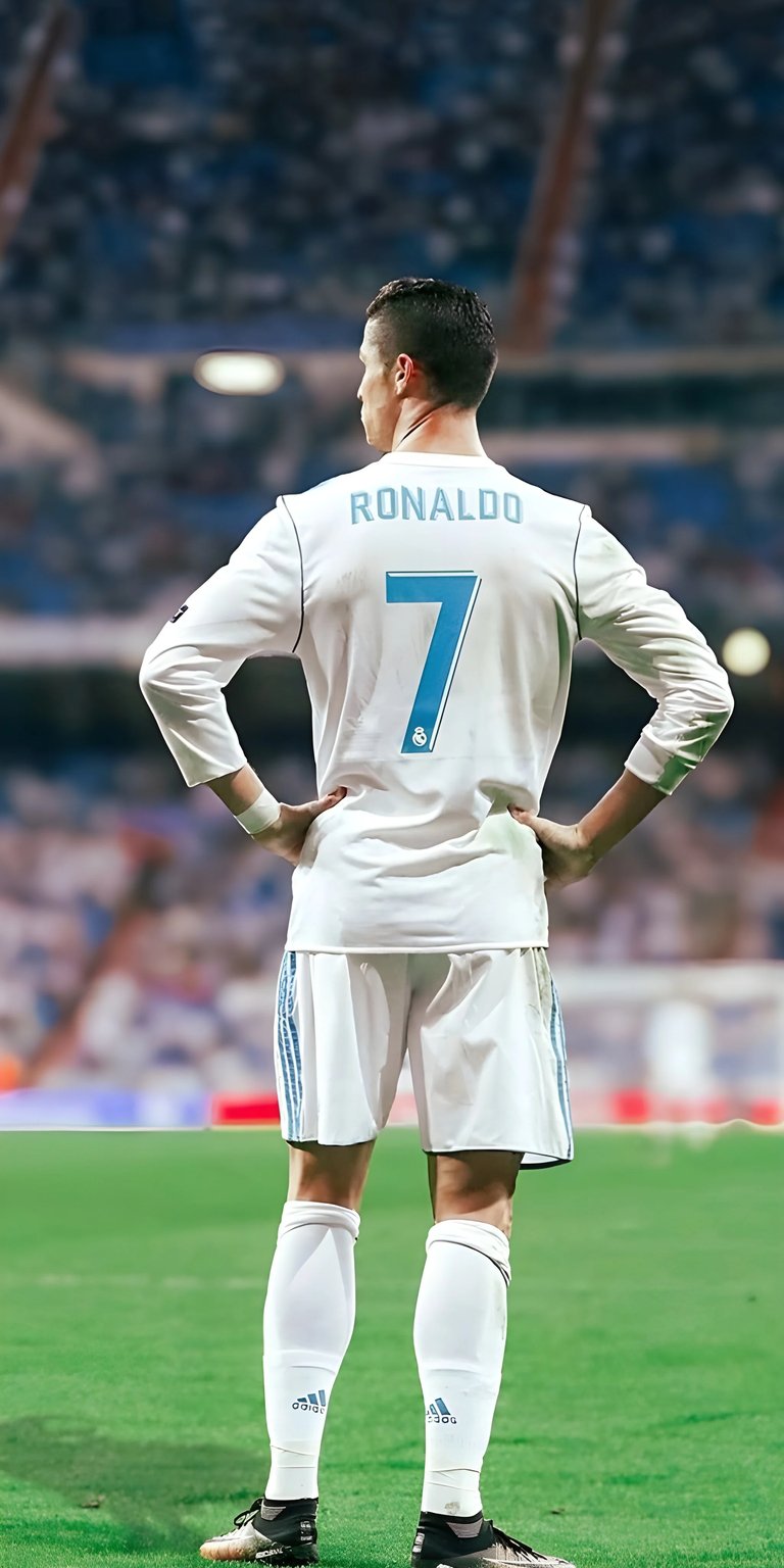 Celebrate football greatness with this 3D spatial wallpaper of Cristiano Ronaldo during his legendary tenure at Real Madrid. Featuring the iconic number 7 jersey, this high-fidelity wallpaper captures the presence of the "GOAT" on the pitch at the Santiago Bernabéu. The 3D depth effect separates Ronaldo from the lush green field and stadium crowd, making him stand out as a true sports icon on your mobile device.