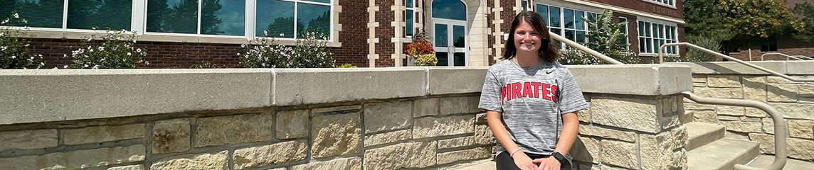 Student in front of Geyer Hall