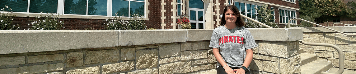 Student in front of Geyer Hall