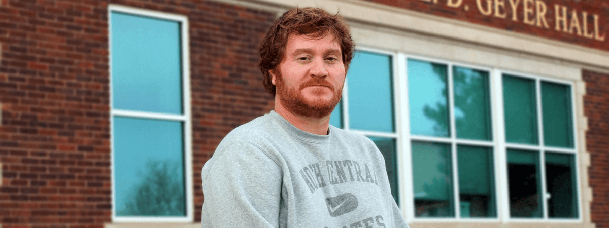 Adult learner in front of Geyer Hall
