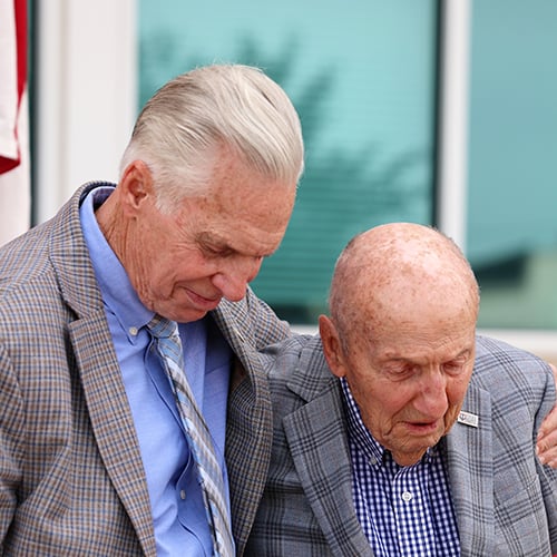 Board members embrace