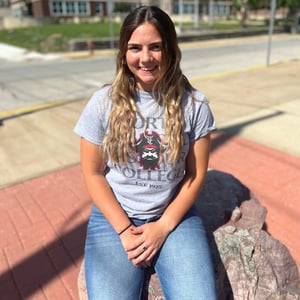 Student sitting on rock