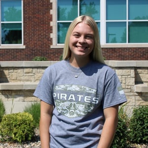 Student wearing a gray tee