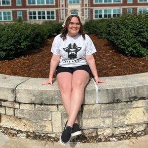 Student sitting on ledge