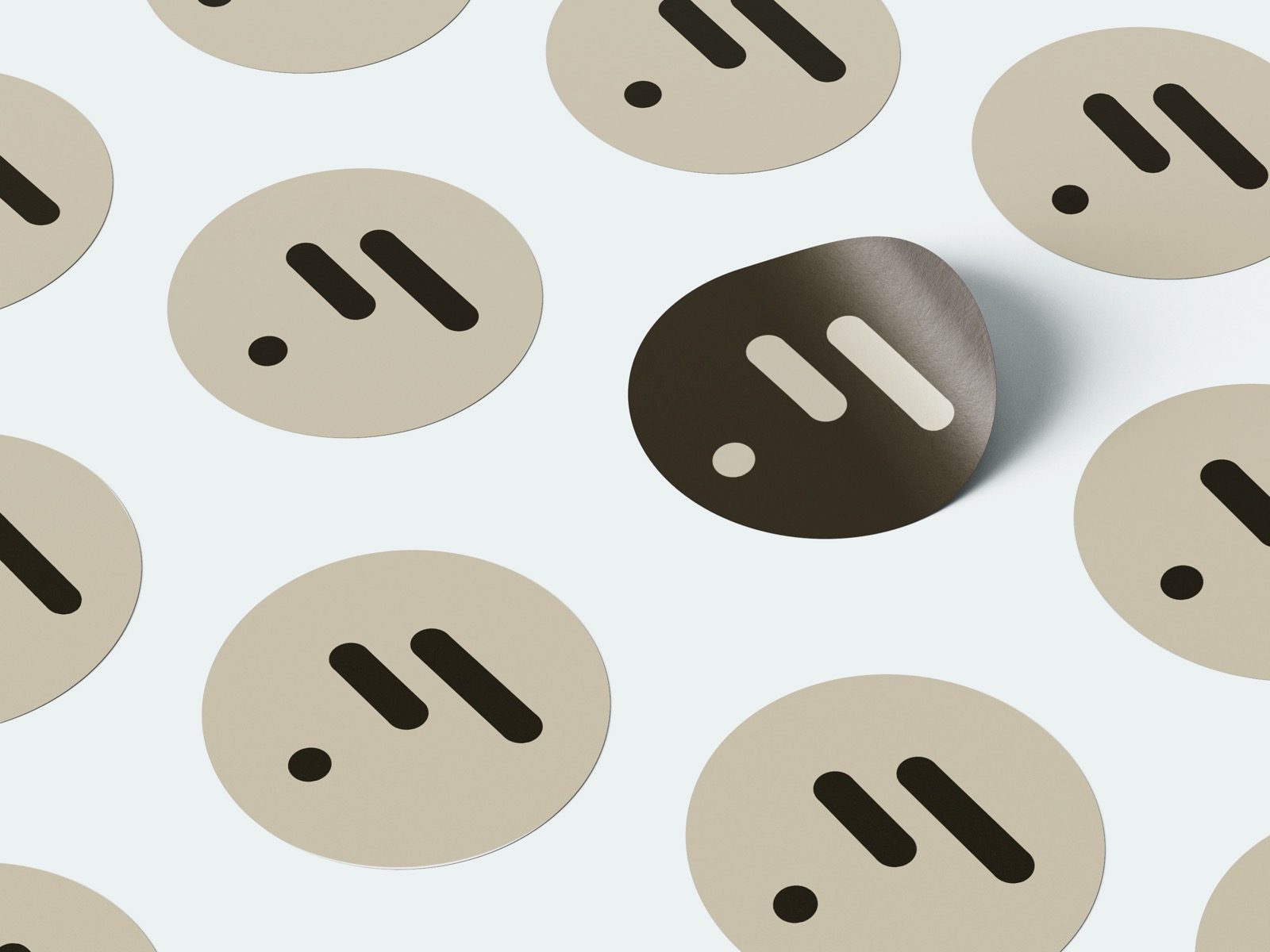 Round stickers with the molecular mark — placed on cups, boxes, bags.
