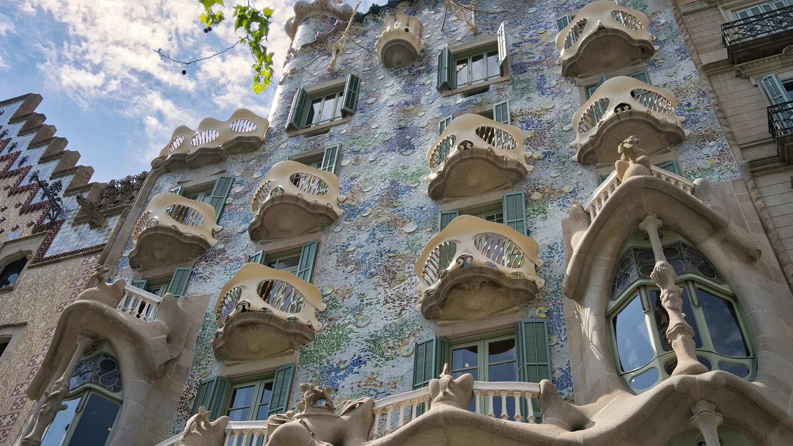 Facade of Casa Batlló in Barcelona with curved balconies and mosaic
