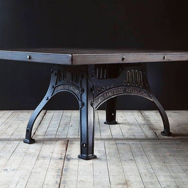 A custom made industrial dining or conference table on machinery base or legs. Guide  price only. 