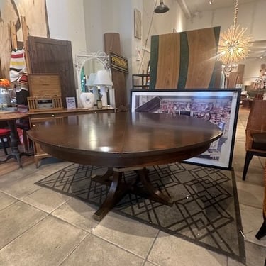 Round June Expandable Dining Table w/ Self Storing Leaves