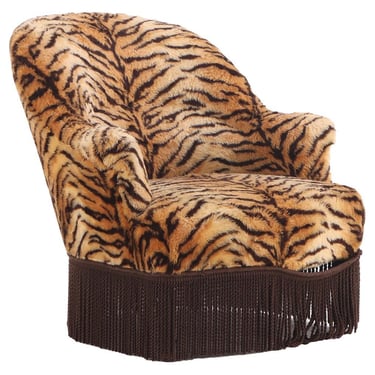 A French Lounge Chair covered in faux tiger fabric, 19th C..