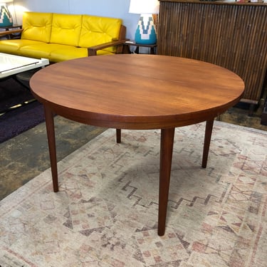 Round Teak Dining Table with Pull-Out Leaf