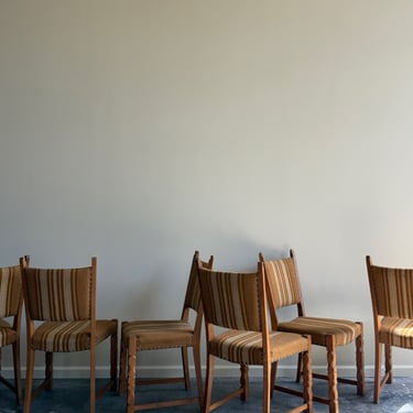 Danish oak dining chairs with striped upholstery. Sold in pairs.