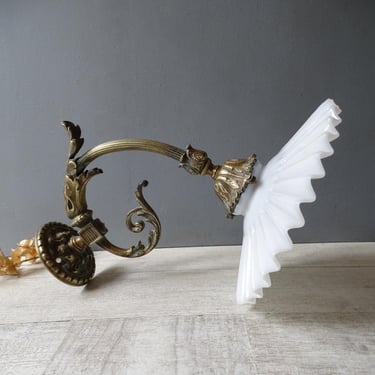 Antique Bronze Sconce  with folded opaline Glass shade. 