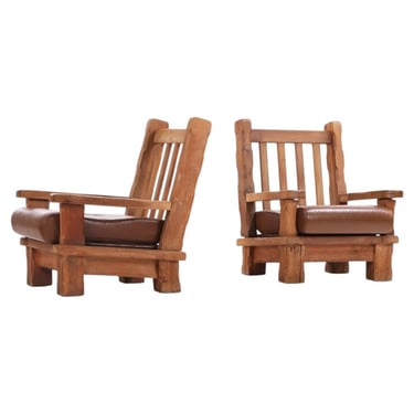 A Pair of French Heavy Oak Brutalist style Open Arm Chairs, C. 1960.