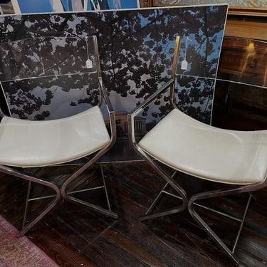 Chrome chairs with lucite back. Two available. 17”x31.5”x21.5”