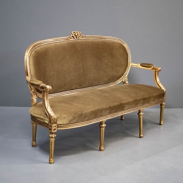 Antique European Hand Carved Ornate Gilded Settee With Vintage Olive Upholstery, Sculpted Floral Motifs & Various Accents