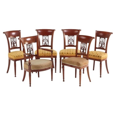 A Set of Six French Directoire Style Carved Walnut Dining Chairs, 19th Century.