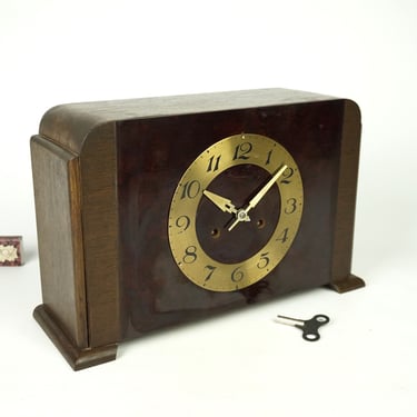 An efficient Art Deco wooden large clock German, vintage Mantle Clock german, clock in the mid-century wood, Mechanical fireplace old clock, 