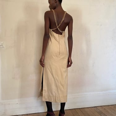 1980s Céline suede dress, fantastic dress, creamy beige super soft suede, side slit, open back with cross heavy weight gold tone metal chain 