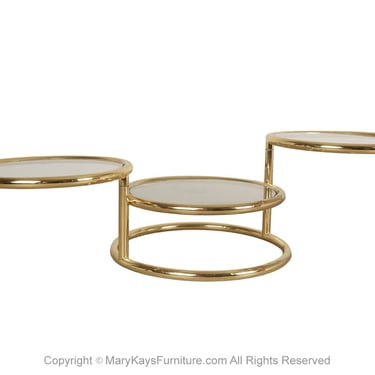 Mid Century Modern Brass Glass Swivel Coffee table in the style of Milo Baughman