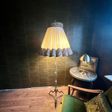 Bronze/brass floor lamp in a beautiful Art Deco design. Very solid and elaborately crafted with a brocade shade. 