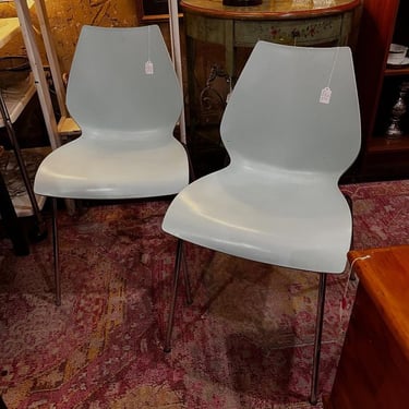 Pale blue bent wood chairs. They stack too! 