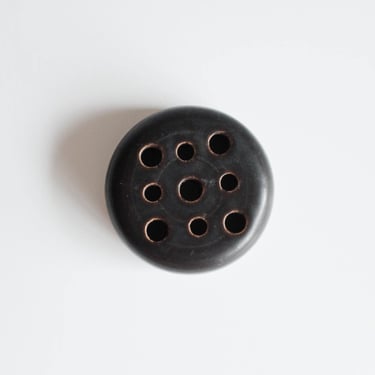 Vintage black ceramic flower frog 