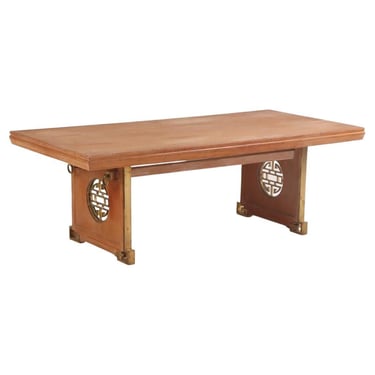 A mahogany and bronze dining table in the manner of James Mont, C. 1950.