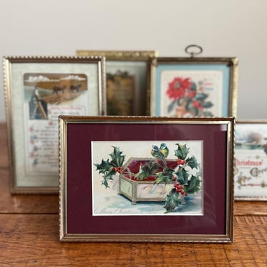 antique Christmas postcard in a vintage brass picture frame with holly and poinsettia 