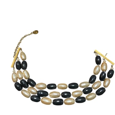 VINTAGE SIGNED KARL LAGERFELD FOUR STRAN Black and cream PEARL BRACELET