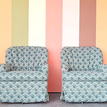 Pair of Shell Motif Upholstered Swivel Chairs