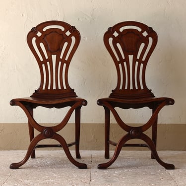 Remarkable Pair of Early George III Pierced Back Currule Hall Chairs Circa 1760