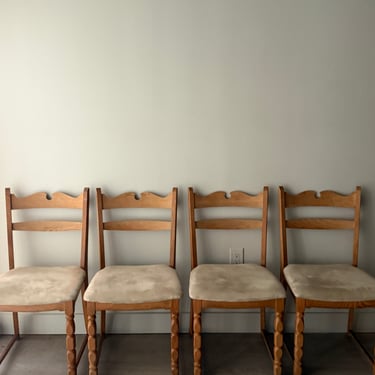 Danish oak dining chairs with suede upholstery. Sold in pairs.