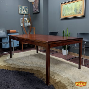 Danish Modern rosewood draw leaf dining table by H. Sigh and Sons (seats 8 to 12)