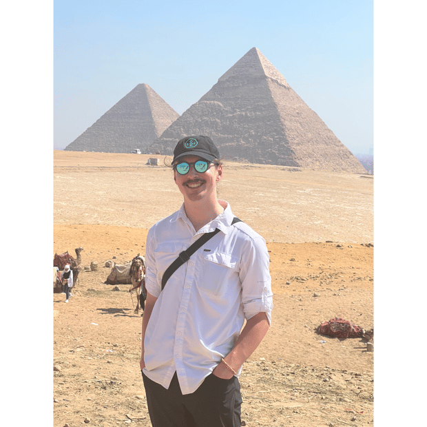Photo of Smiling in front of the pyramids