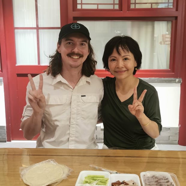 Photo of Yao's Mom treating me to Peking duck while I was sick in Beijing
